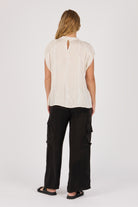 Ellis & Dewey Pleat Neckline Blouse in Gardenia – viscose satin twill blouse with pleated neckline and cap sleeves, designed in Geelong Australia.