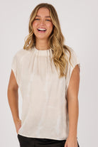 Ellis & Dewey Pleat Neckline Blouse in Gardenia – viscose satin twill blouse with pleated neckline and cap sleeves, designed in Geelong Australia.