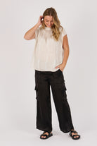 Ellis & Dewey Pleat Neckline Blouse in Gardenia – viscose satin twill blouse with pleated neckline and cap sleeves, designed in Geelong Australia.