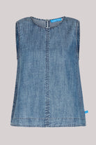 Model wearing a dark blue 100% lyocell swing top with contrast seam detailing.