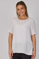 Ellis & Dewey Pleat Back Detail Top in White – linen lyocell short-sleeve top with ladder-trim neckline, pleated back and relaxed silhouette, designed in Geelong Australia.